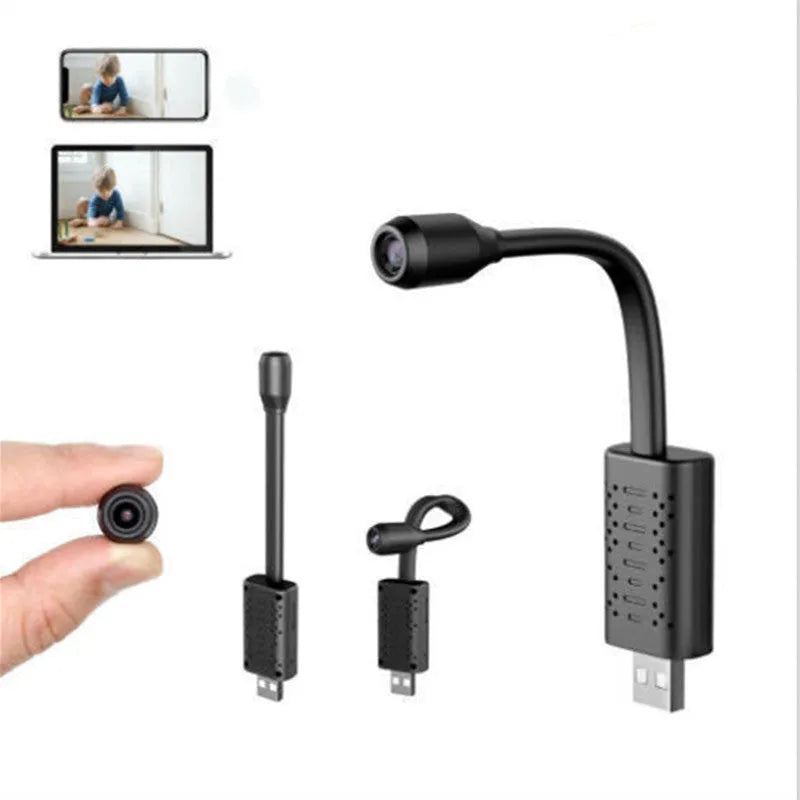 Black V380 wireless USB security camera on a wooden surface next to a microSD card and USB cable.