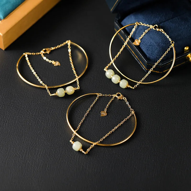 Women's Hetian jade lucky beads bracelet with gold inlay in a fake two pieces style.