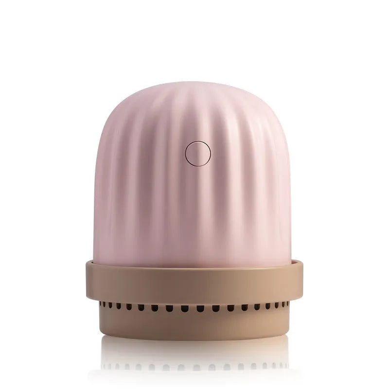 Cactus humidifier night light in green with colourful LED glow on a wooden desk