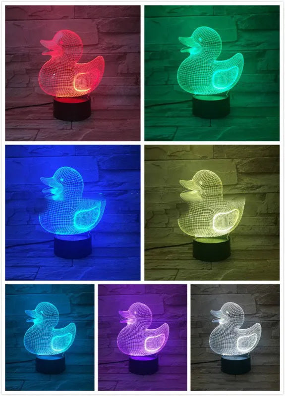 Little yellow duck 3D night light on a table, showing its cartoon design and colourful LED glow.