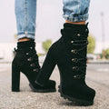 Women's army green suede Roman boots with high thick heels, a platform sole, and decorative rivets.