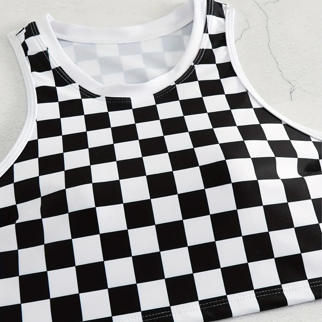 Adult female backless racing swimsuit with suspender straps in checkerboard print pattern