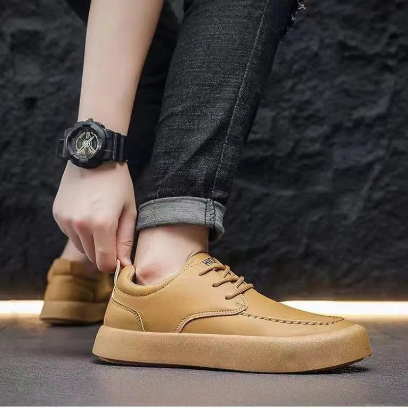 Men's brown and black lace-up casual platform trainers with a round toe and flat heel.