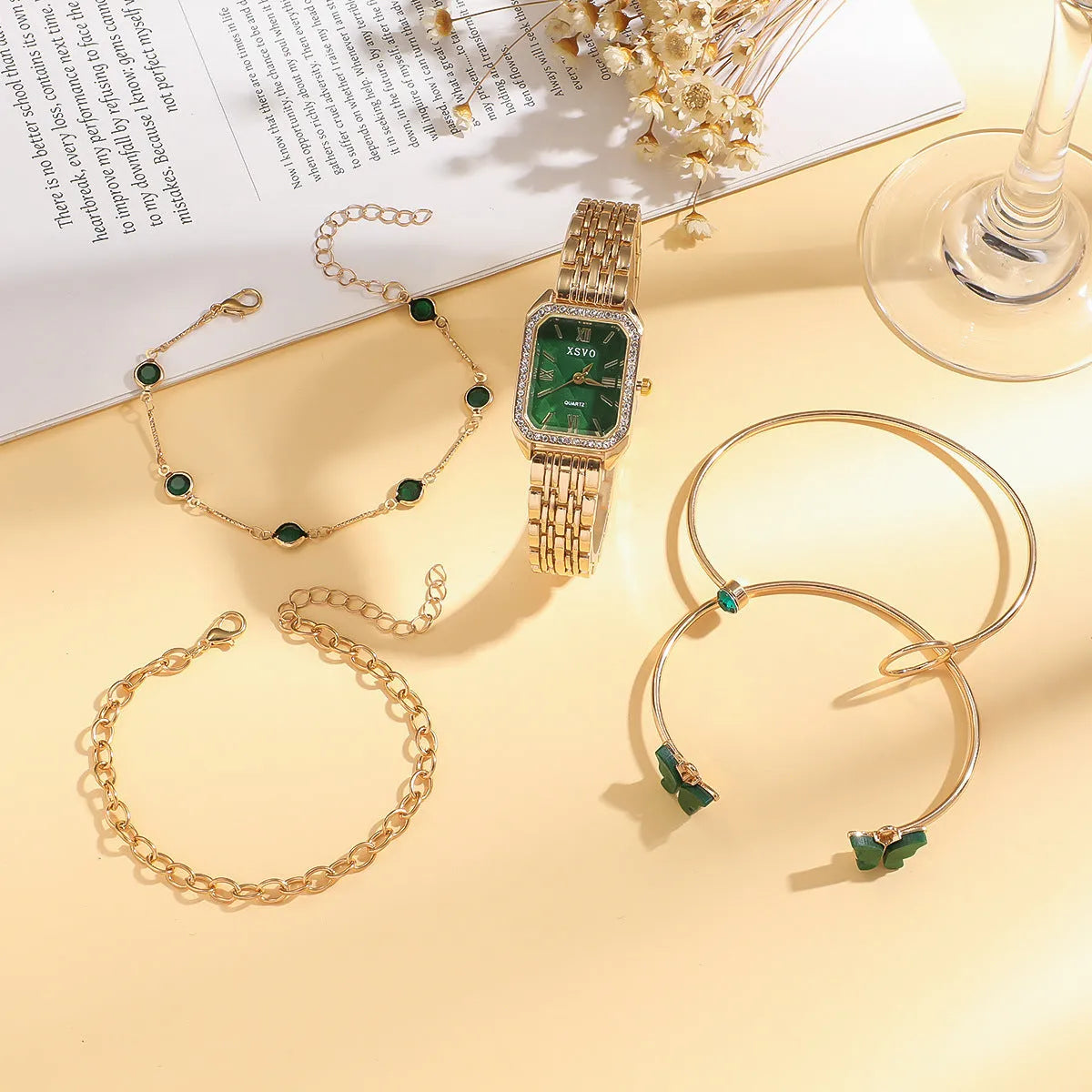 Gold green women's square watch with four matching bracelets showing 25mm dial and alloy construction