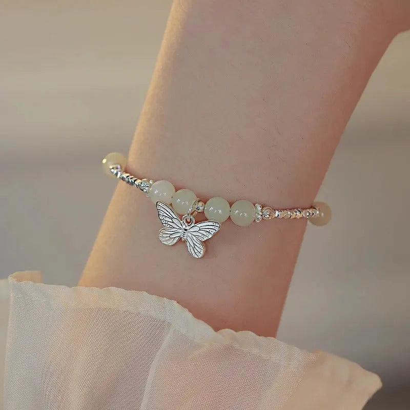 Copper bracelet and necklace set with silver electroplating and butterfly designs featuring Hetian jade accents