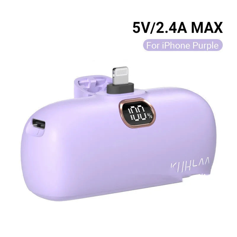 Compact cylindrical alloy power bank with built-in charging cable and LCD digital display.