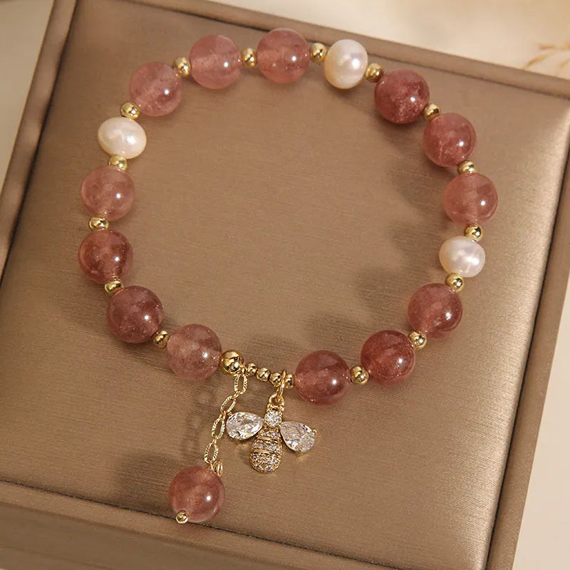 Women's bracelet with strawberry quartz beads, freshwater pearls, zircon details and an alloy clasp