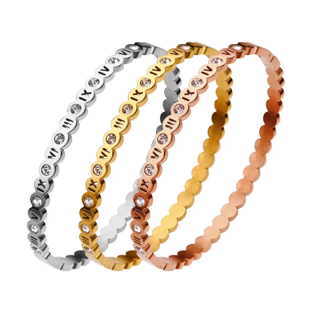 Korean style titanium steel bracelet with electroplated finish in gold, rose gold or steel colour with number charm detail
