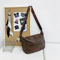 Retro brown men's crossbody bag showing 50cm width and PU construction with adjustable strap