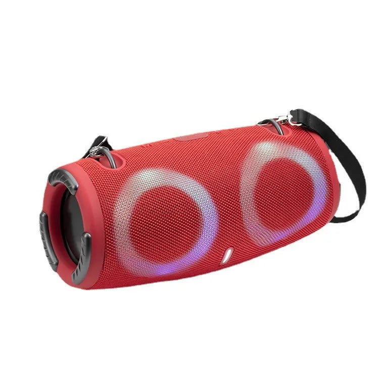 War Drum portable Bluetooth speaker in camouflage colour with dynamic RGB lights, showing carrying strap and control buttons.