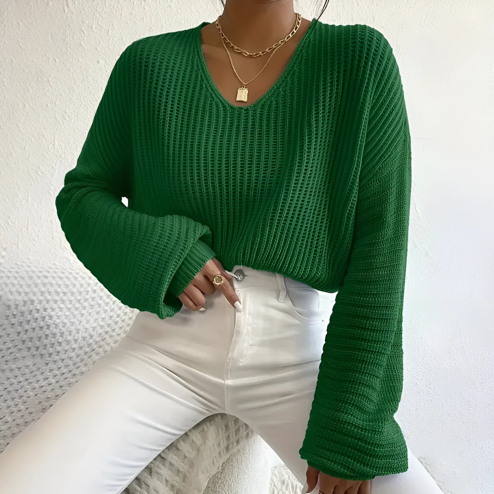 Women's solid colour long sleeve casual pullover in a loose fit, shown in various colours.