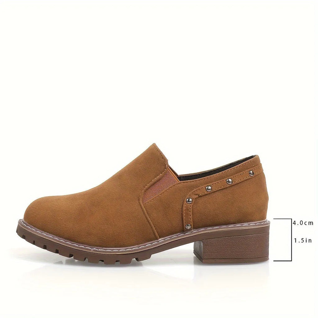 Women's light brown suede ankle boots with a low block heel and elasticated ankle cuff.