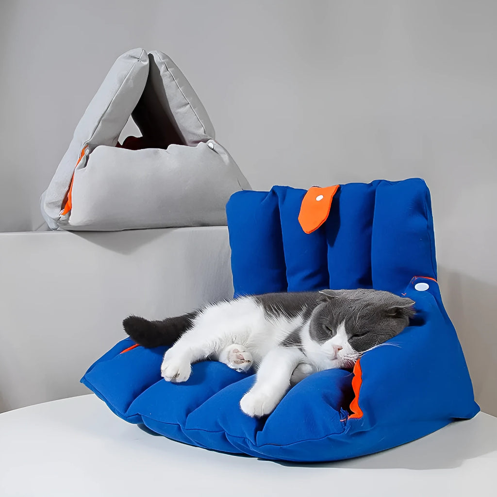Blue triangular cat bed with removable cotton cover showing drilled holes for connecting multiple units