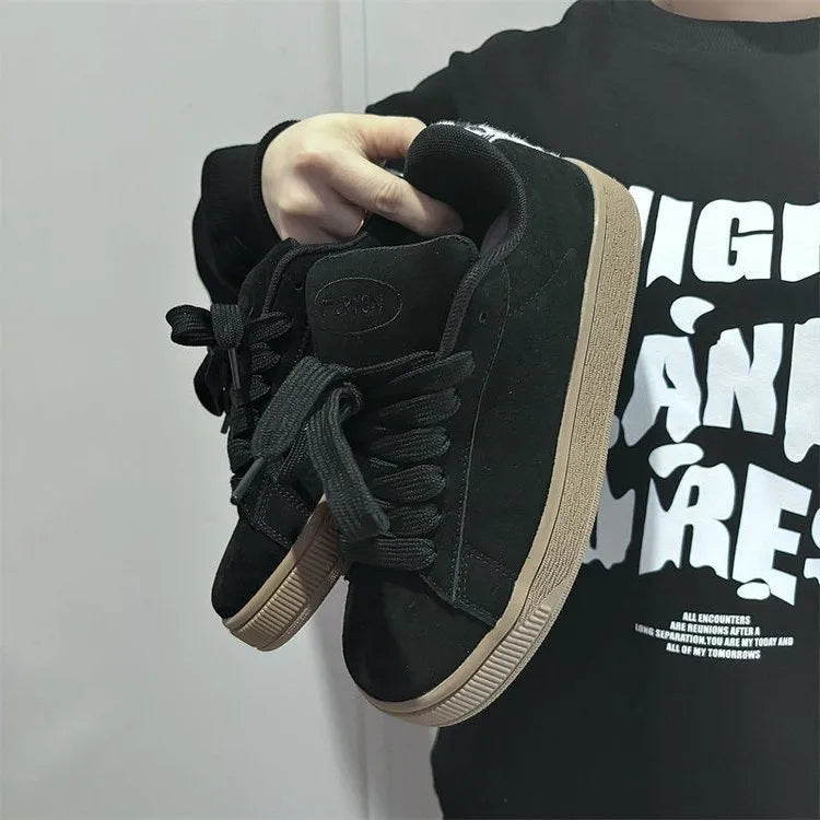 Black retro low-top sneakers with waterproof platform sole and round toe design