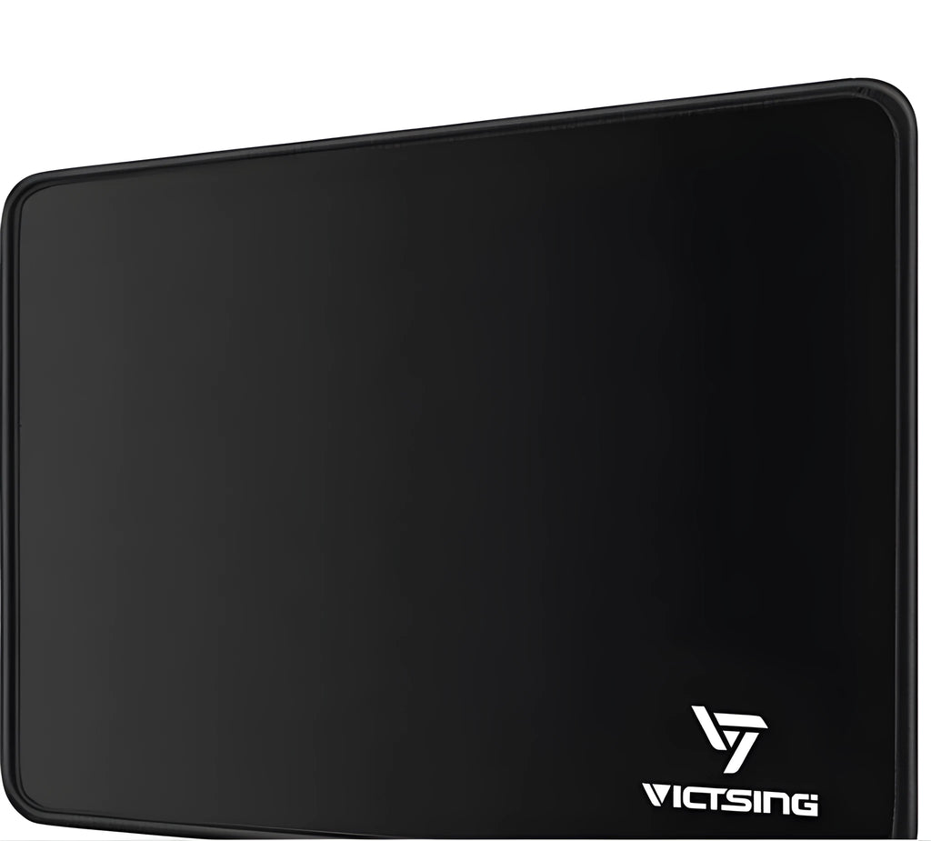 Black rough grain rubber desk mat for keyboard and mouse, shown on a desk
