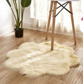 Artificial woolen floral sheepskin hairy plush carpet rug in beige colour, 60x60 cm size, on a tiled floor