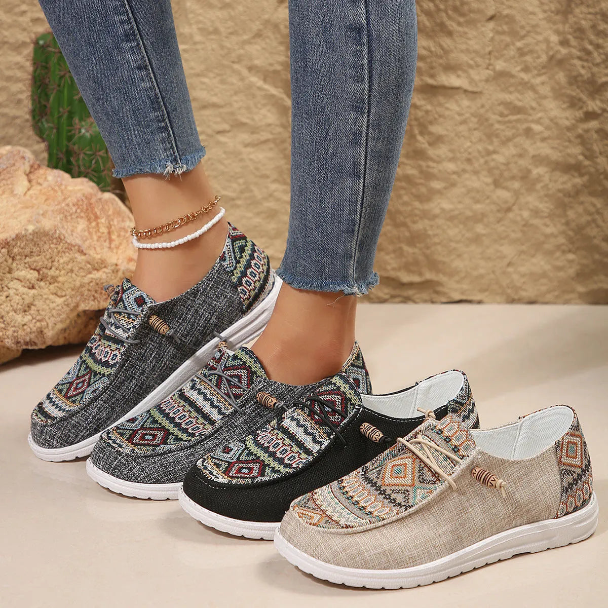 Women's flat round-toe low-top shoes in black, dark grey, or khaki with a rubber sole.
