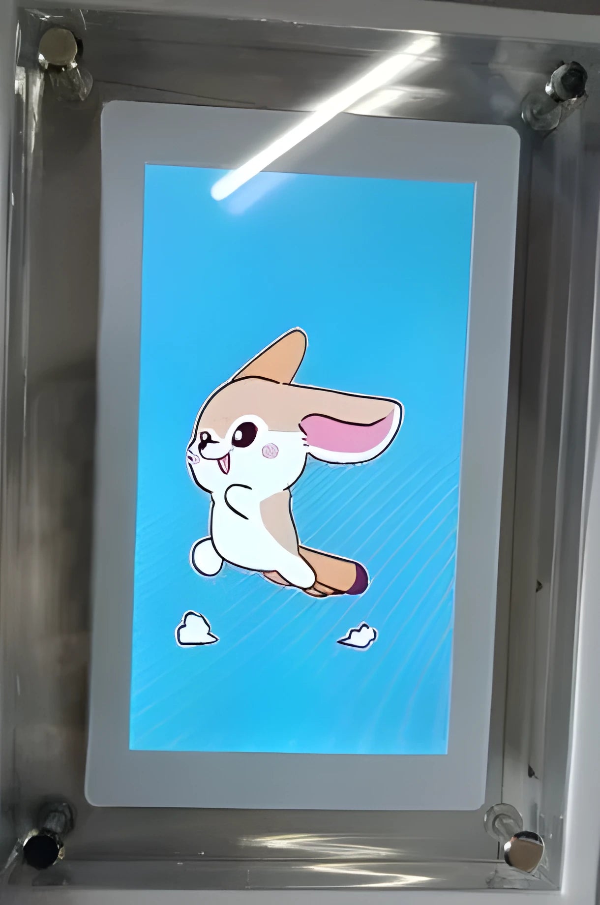 White vertical digital picture frame with 5-inch screen on a table
