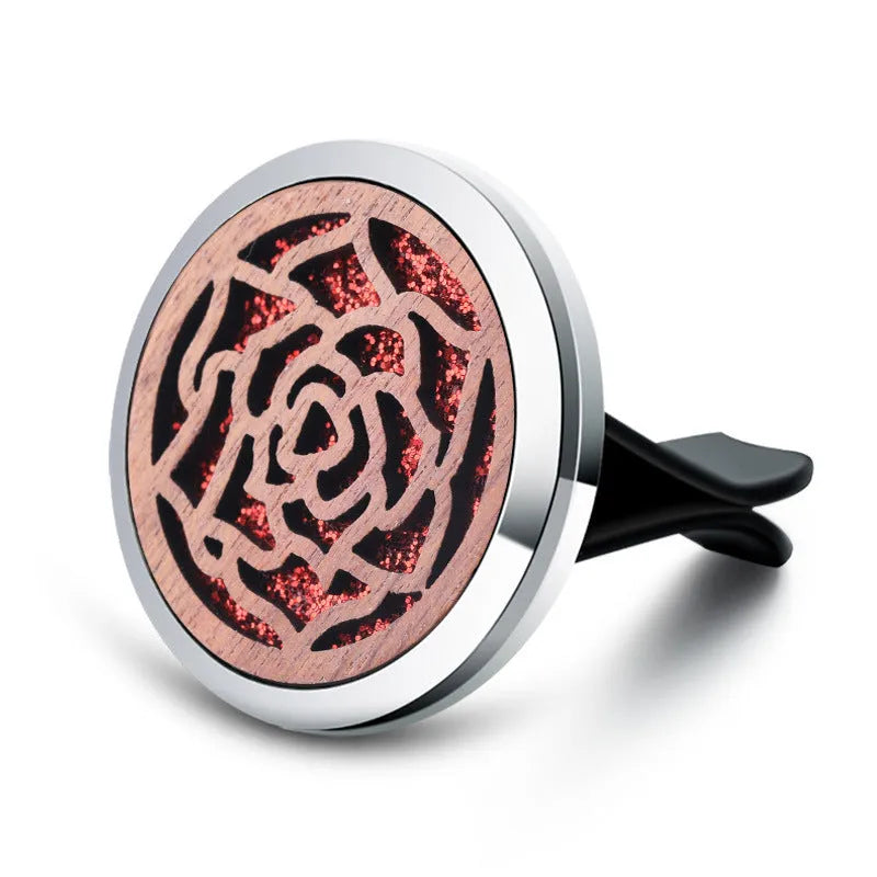 Round car vent aromatherapy clip in alloy wood construction showing hollow centre for incense