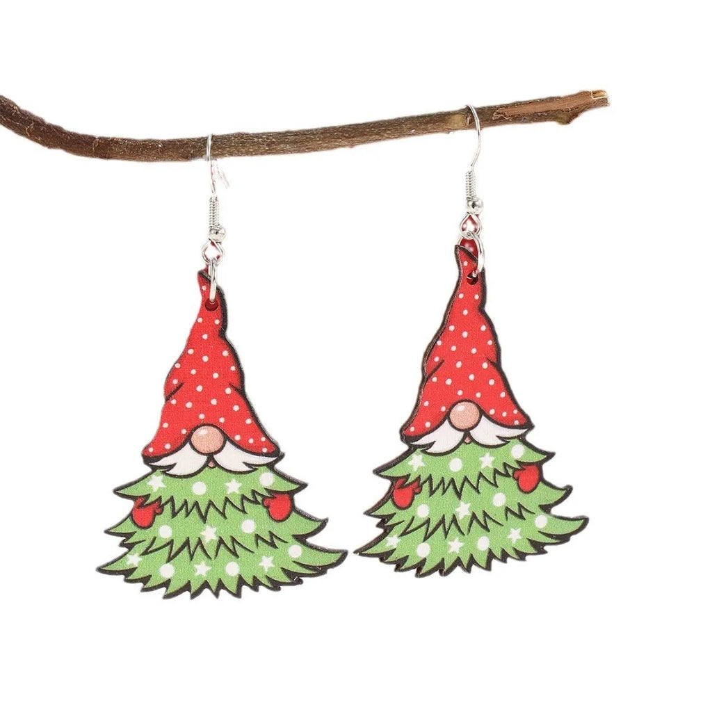 Wooden geometric Christmas earrings with printed festive designs on a white background.