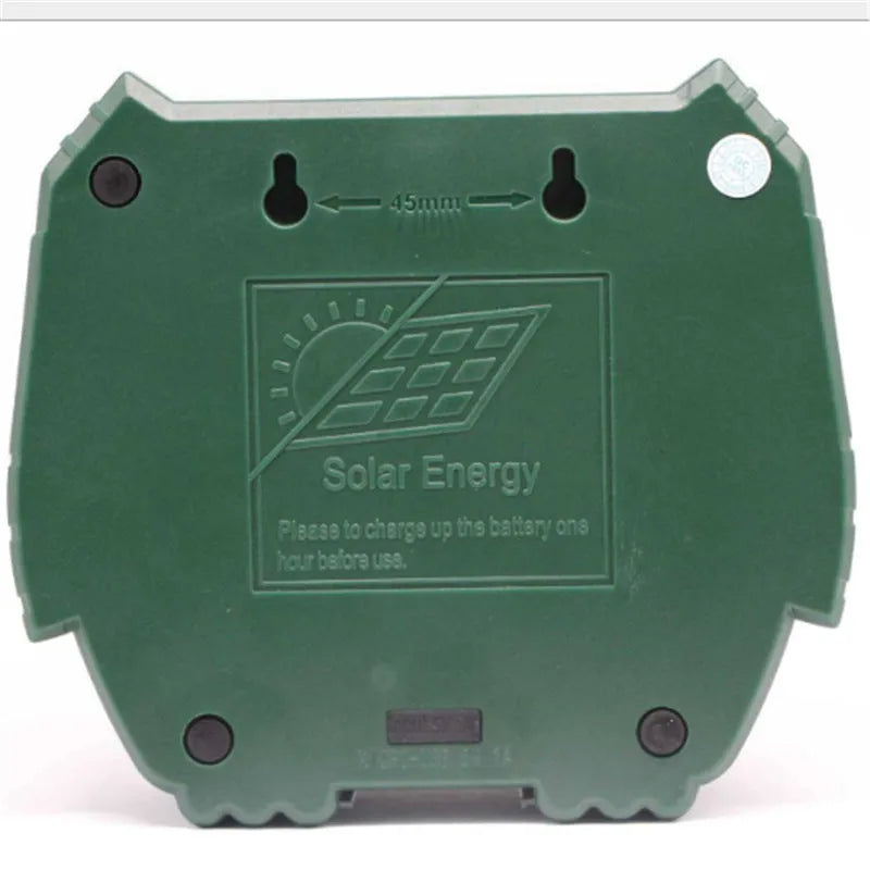 Green solar-powered ultrasonic animal repeller unit with LED light for outdoor pest control.