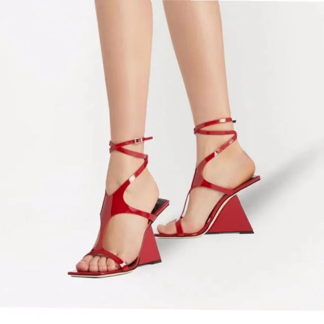 Women's black square-toe high heel sandals with a block heel and button fastening.