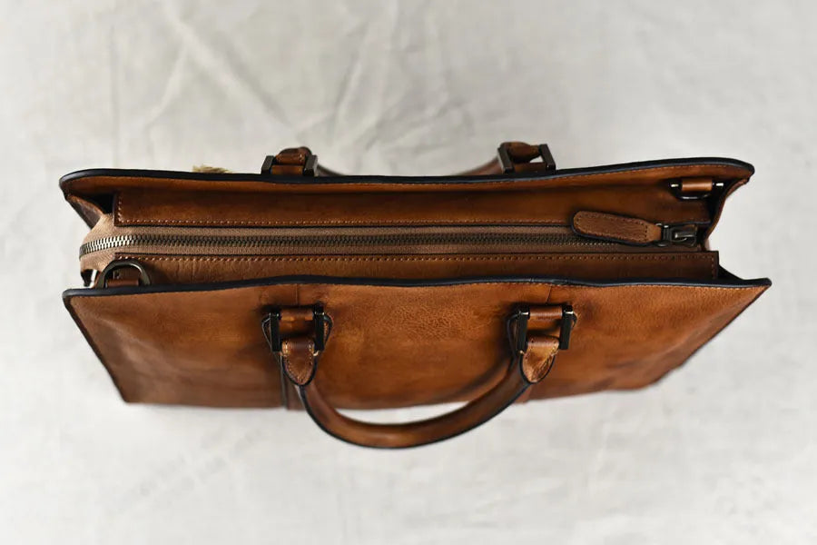 Men's brown leather handbag with horizontal square design and zipper closure