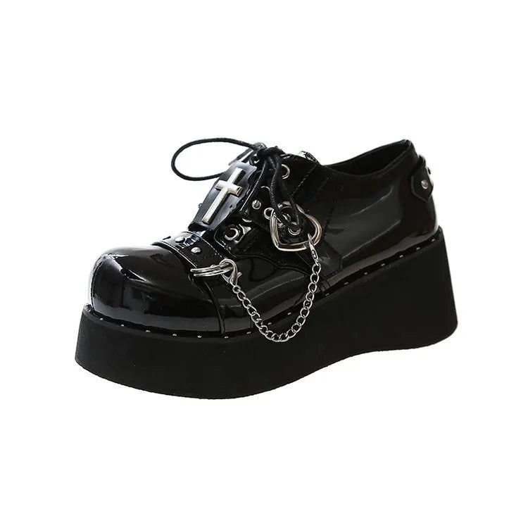 Solid black punk platform shoes with leather upper, rubber sole, and visible stitching detail