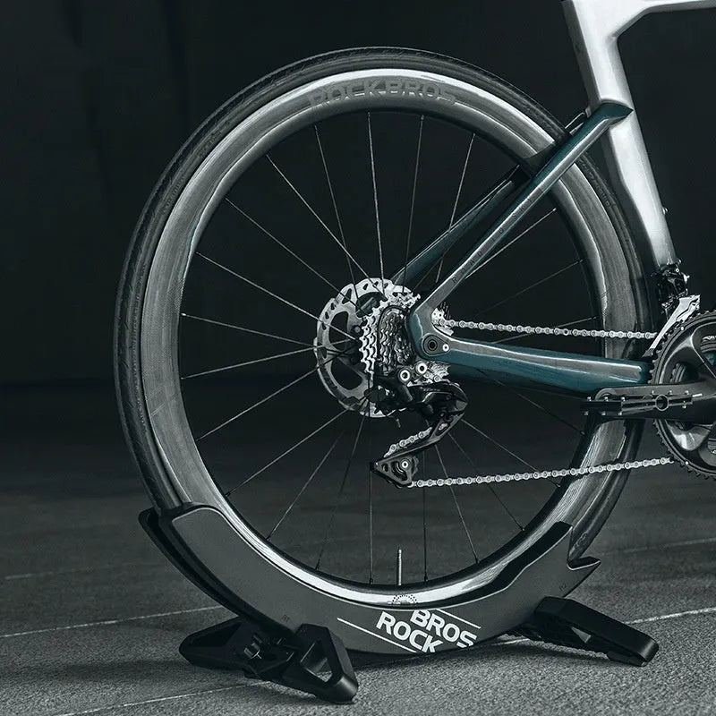 Black and green ABS plastic bicycle parking rack holder for road and mountain bikes