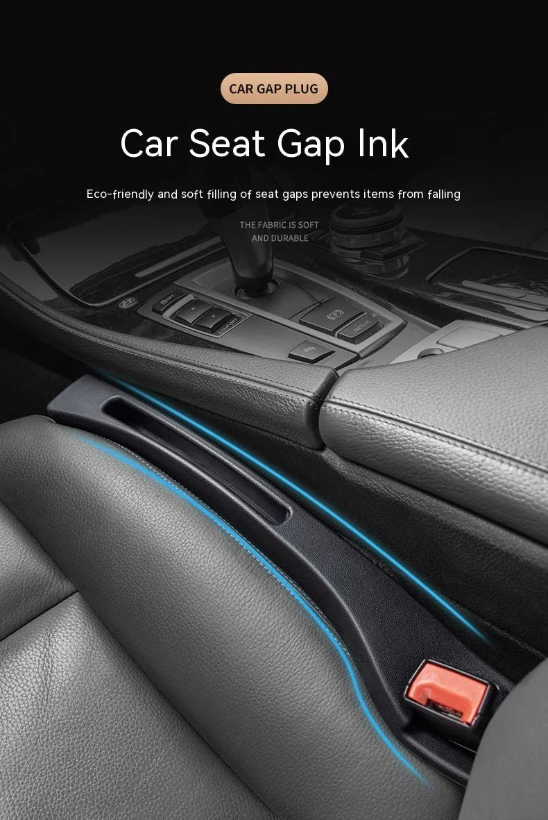 Black plastic car seat gap storage organiser box with handle inserted between vehicle seats