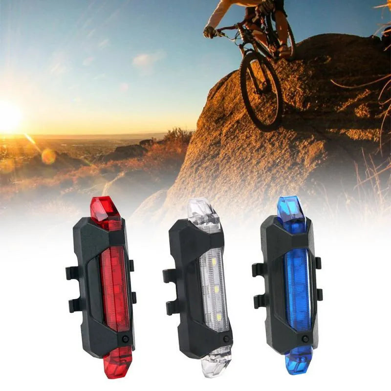 USB rechargeable red bicycle tail light with rubber buckle strap on a bike seat post