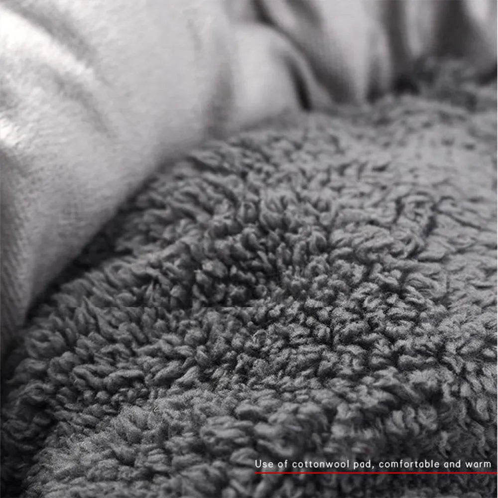 Grey round plush pet bed with removable pillow and non-slip base in four size options