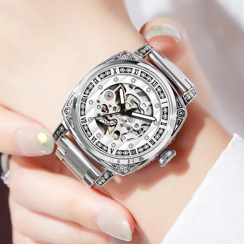 Men's black mechanical watch with luminous hands on a leather strap, showing water resistance.