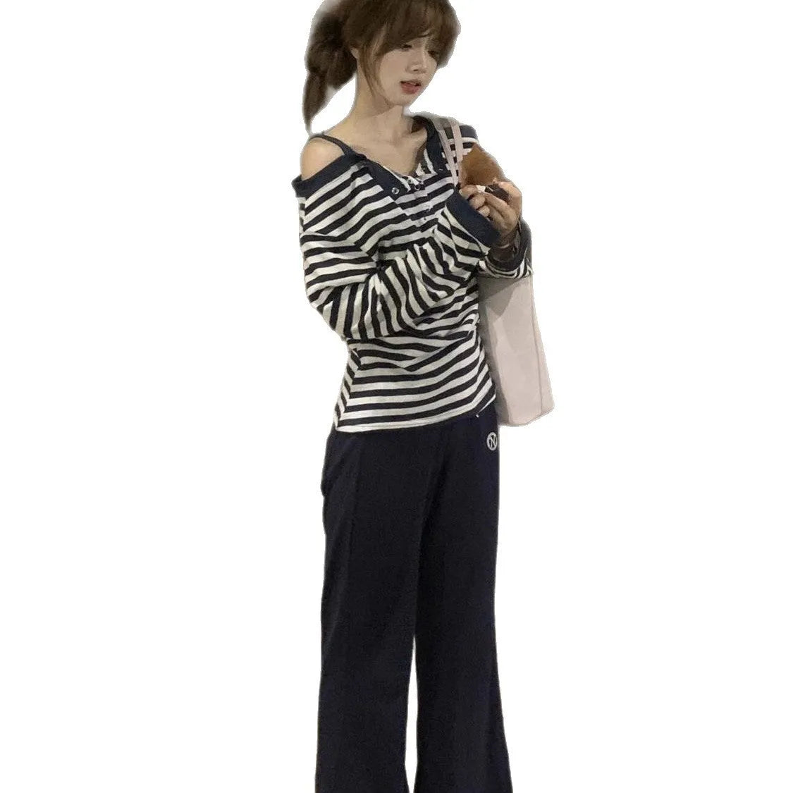 Dark blue women's oversized long-sleeved T-shirt with embroidery and stripes, laid flat.