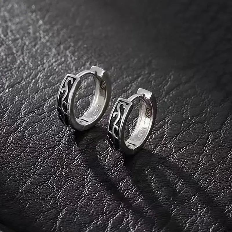West Coast men's geometric copper earring studs on a plain background, showing silver and patterned options.