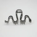 Slytherin serpentine snake design metal hair barrette in silver or gun black, measuring 10.5 cm.