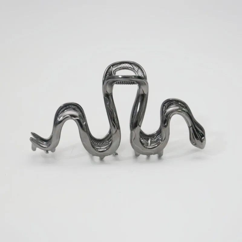 Slytherin serpentine snake design metal hair barrette in silver or gun black, measuring 10.5 cm.