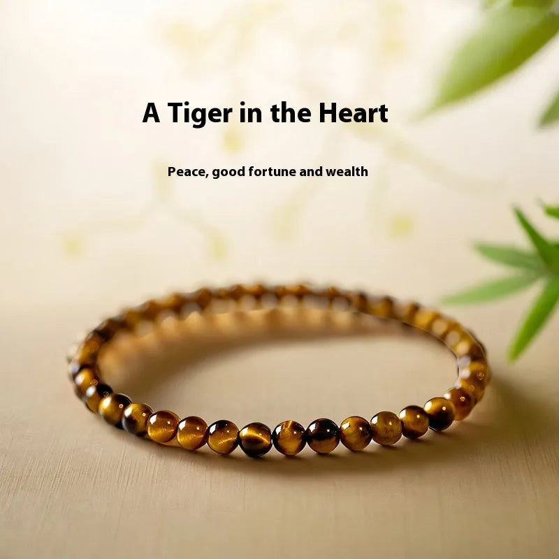Handmade new Chinese style tigereye geometric round bead bracelet showing natural banding patterns