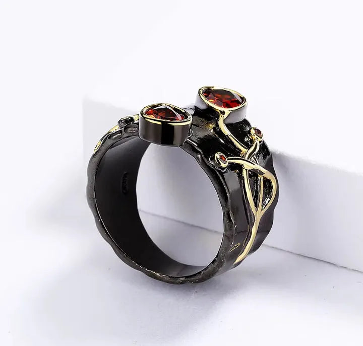 Women's black brass straight-pull oval ring on a neutral background