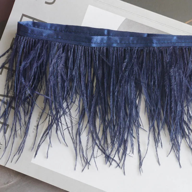 Decorative feather cloth strip in multiple colours including white, black, and mint green for DIY clothing and craft projects