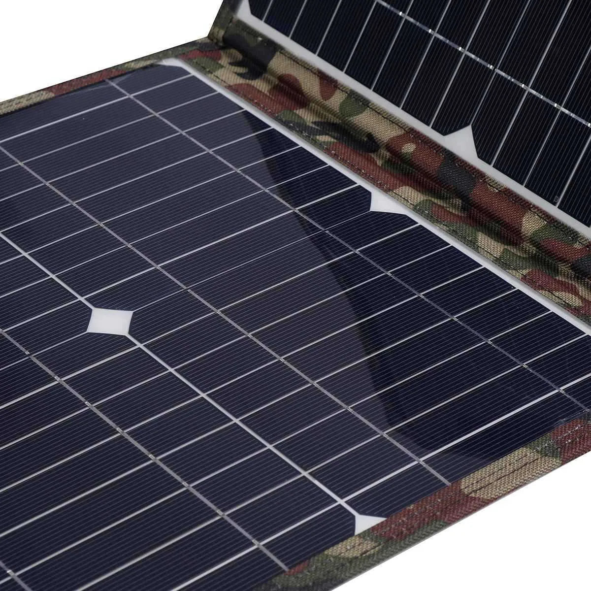 Black foldable 36W solar panel unfolded showing three monocrystalline silicon cells with charging accessories