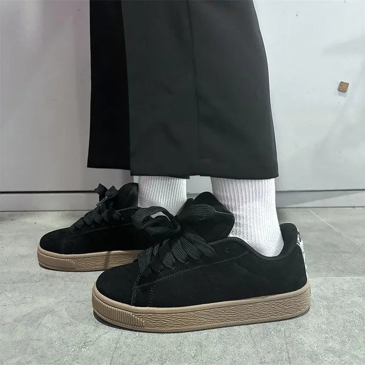 Black retro low-top sneakers with waterproof platform sole and round toe design