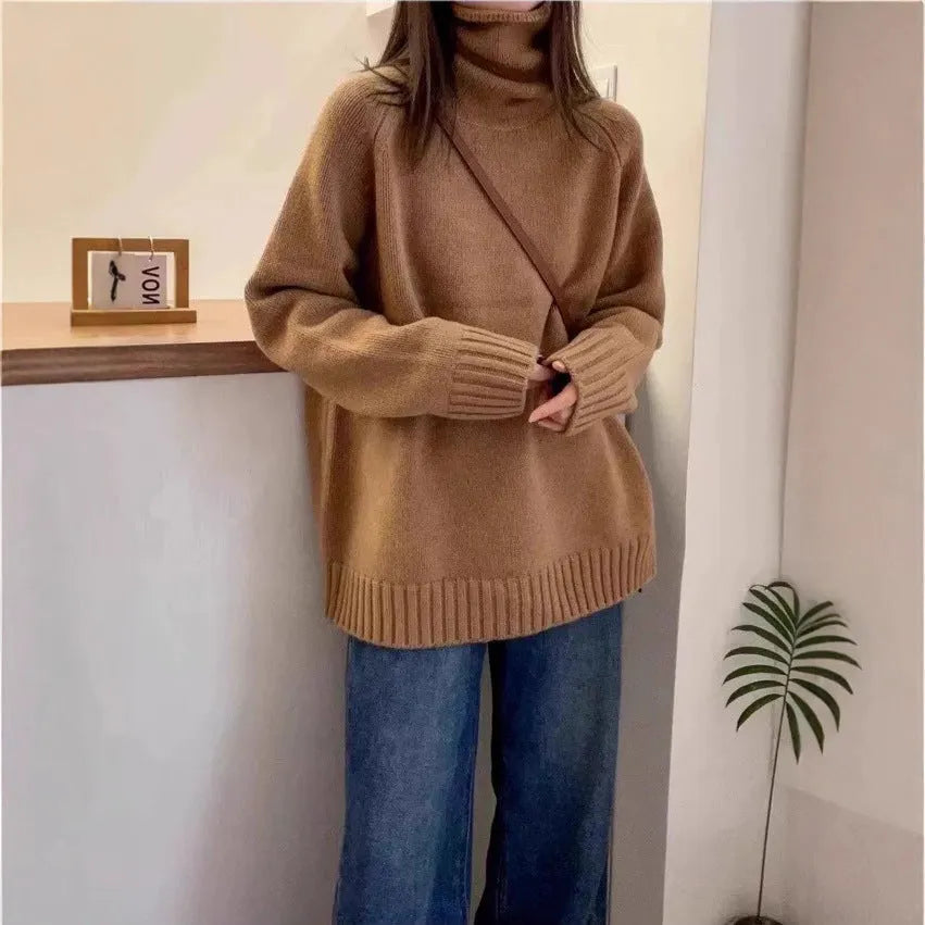 Women's loose fit black turtleneck sweater with a thick curling pile collar.