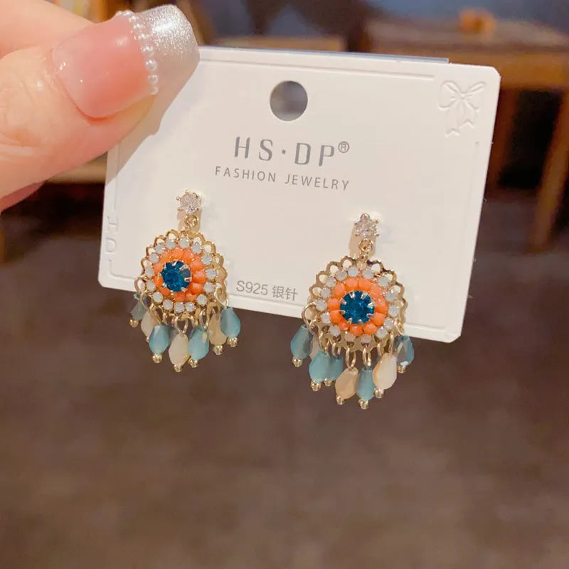 Purple and blue diamond-embedded round crystal tassel earrings with thick gold plating