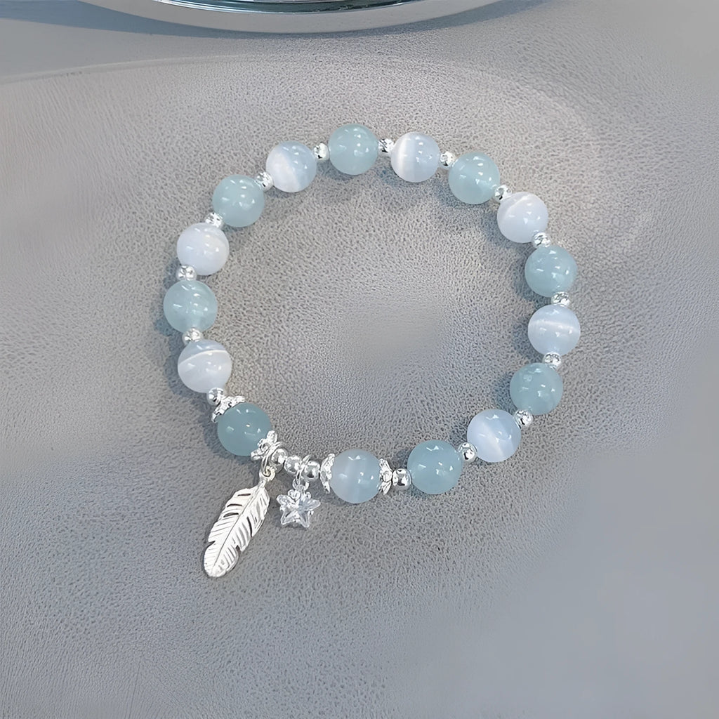 Korean style glass and coloured glaze crystal bracelet in feather XINGX blue moonlight colour with text detailing
