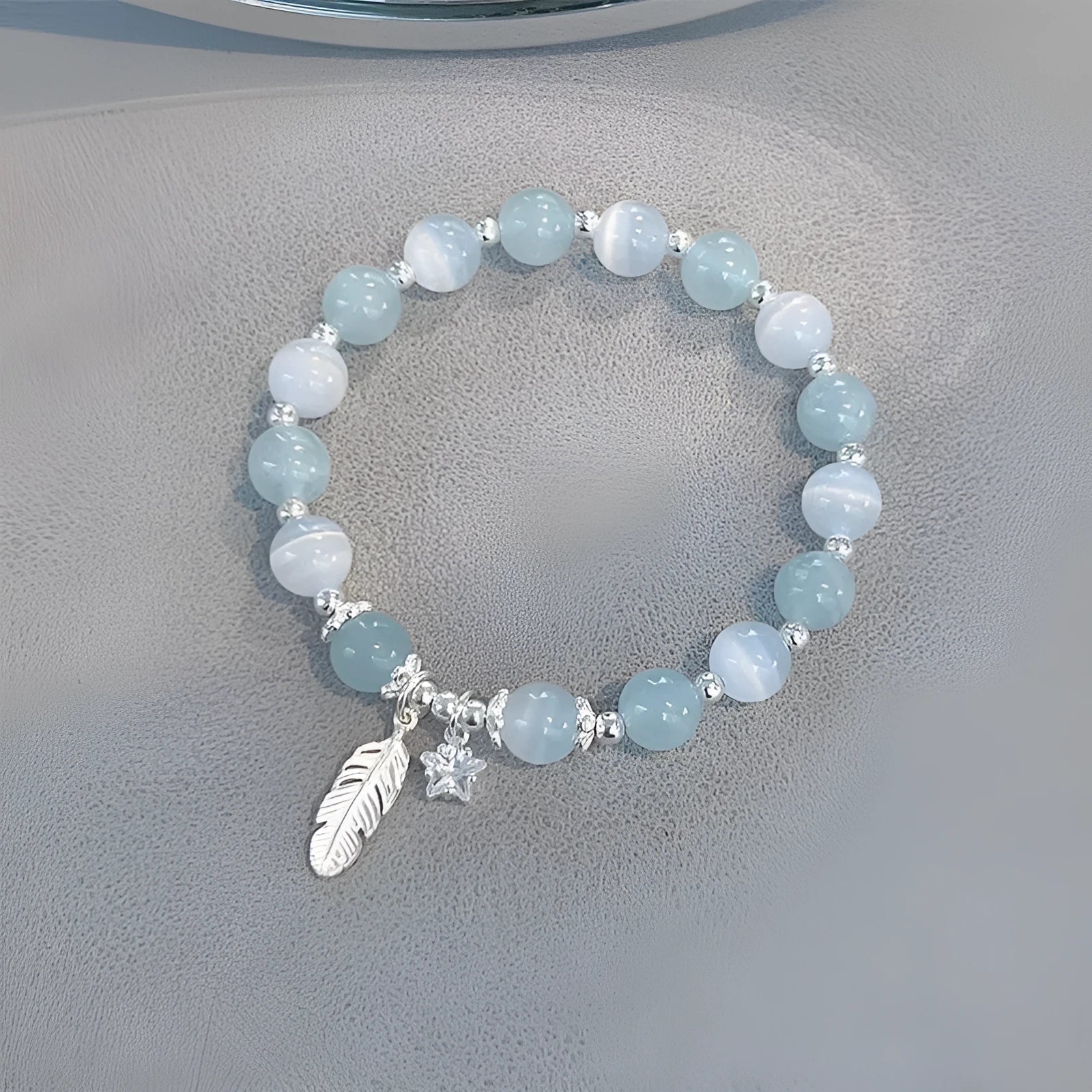 Korean style glass and coloured glaze crystal bracelet in feather XINGX blue moonlight colour with text detailing