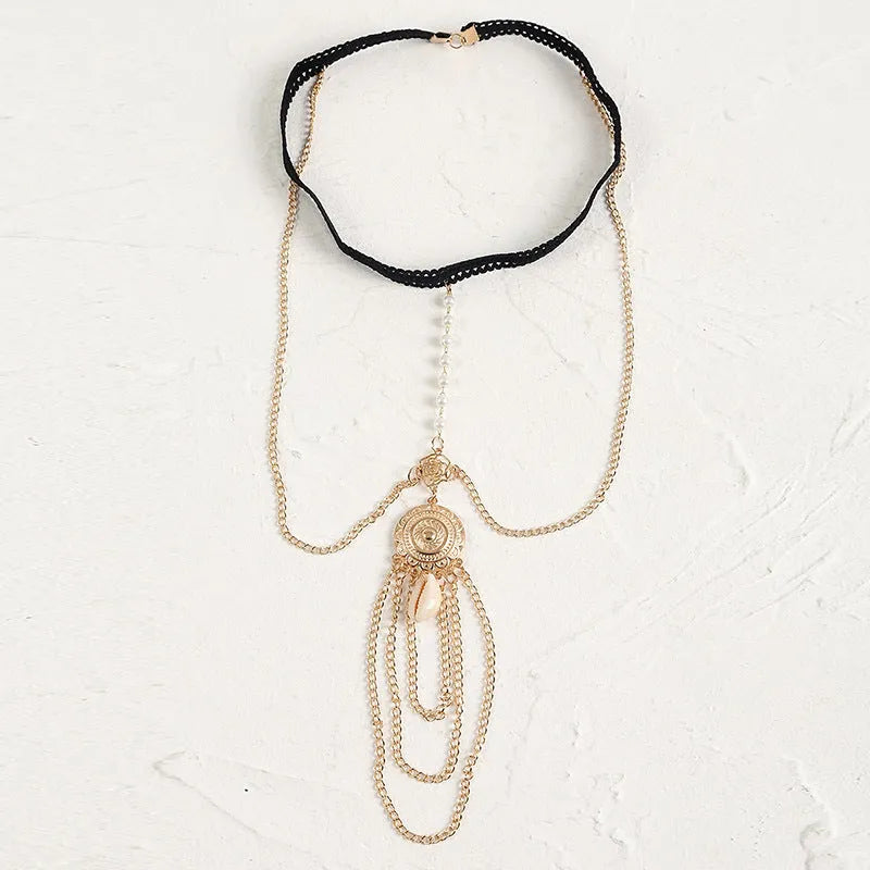 Women's white pearl multi-layer geometric body chain anklet on a light background