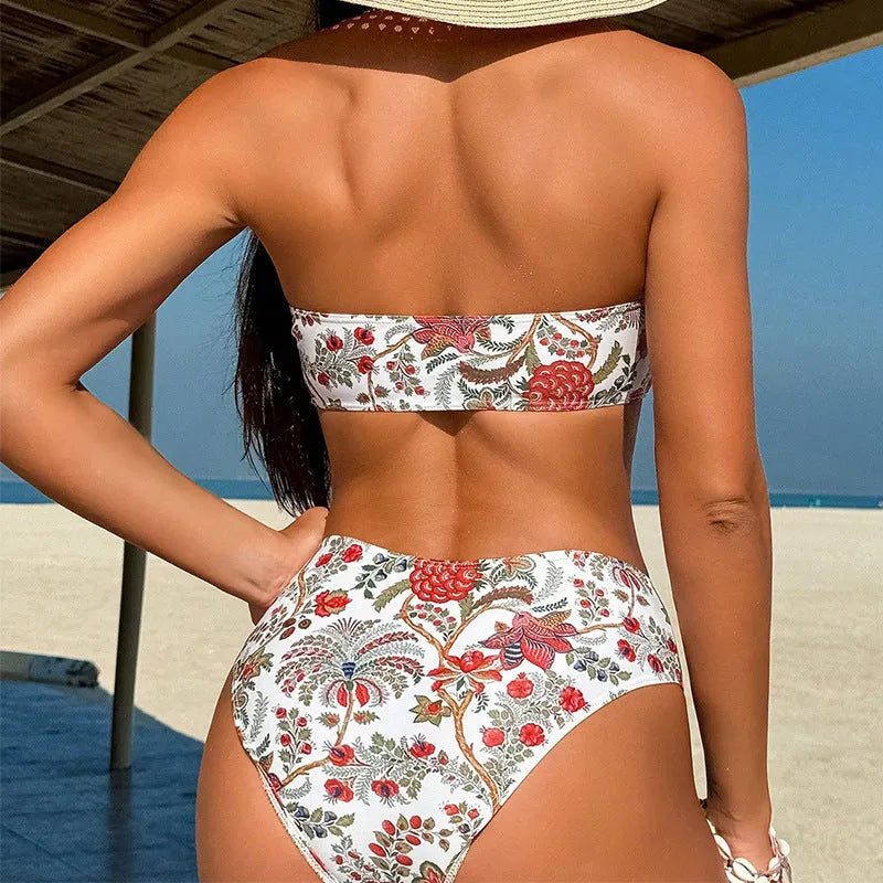 Women's printed bandeau bikini top and matching high-rise shorts with side ties on a mannequin.