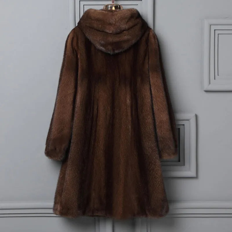 Women's long black faux fur hooded coat for winter street fashion.