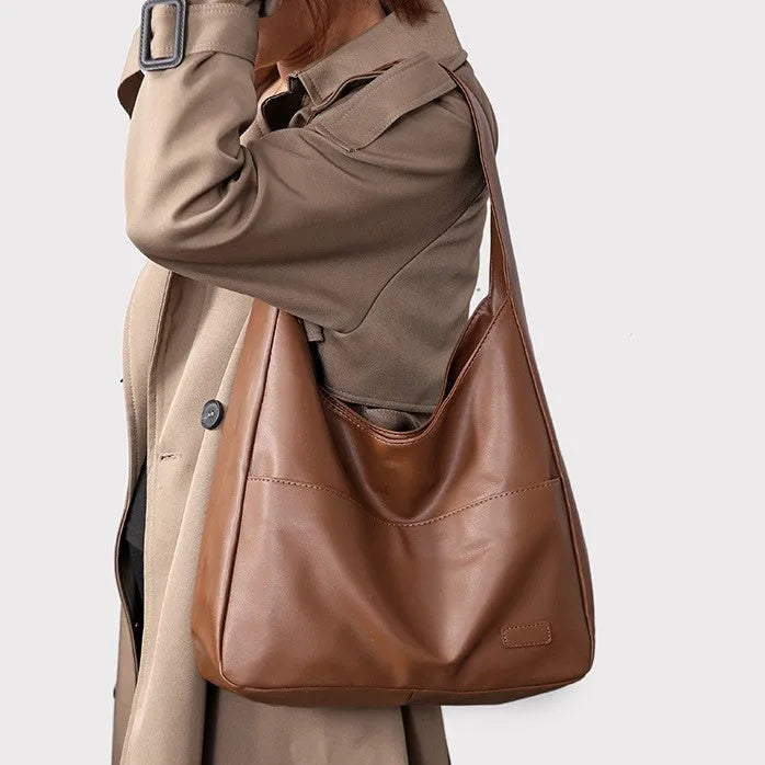 Women's soft PU shoulder bag in European retro style with zipper compartment and sewing thread details